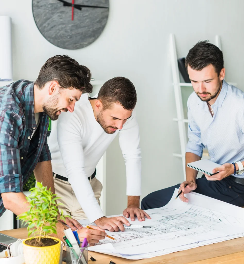 Group male architect preparing blueprint office