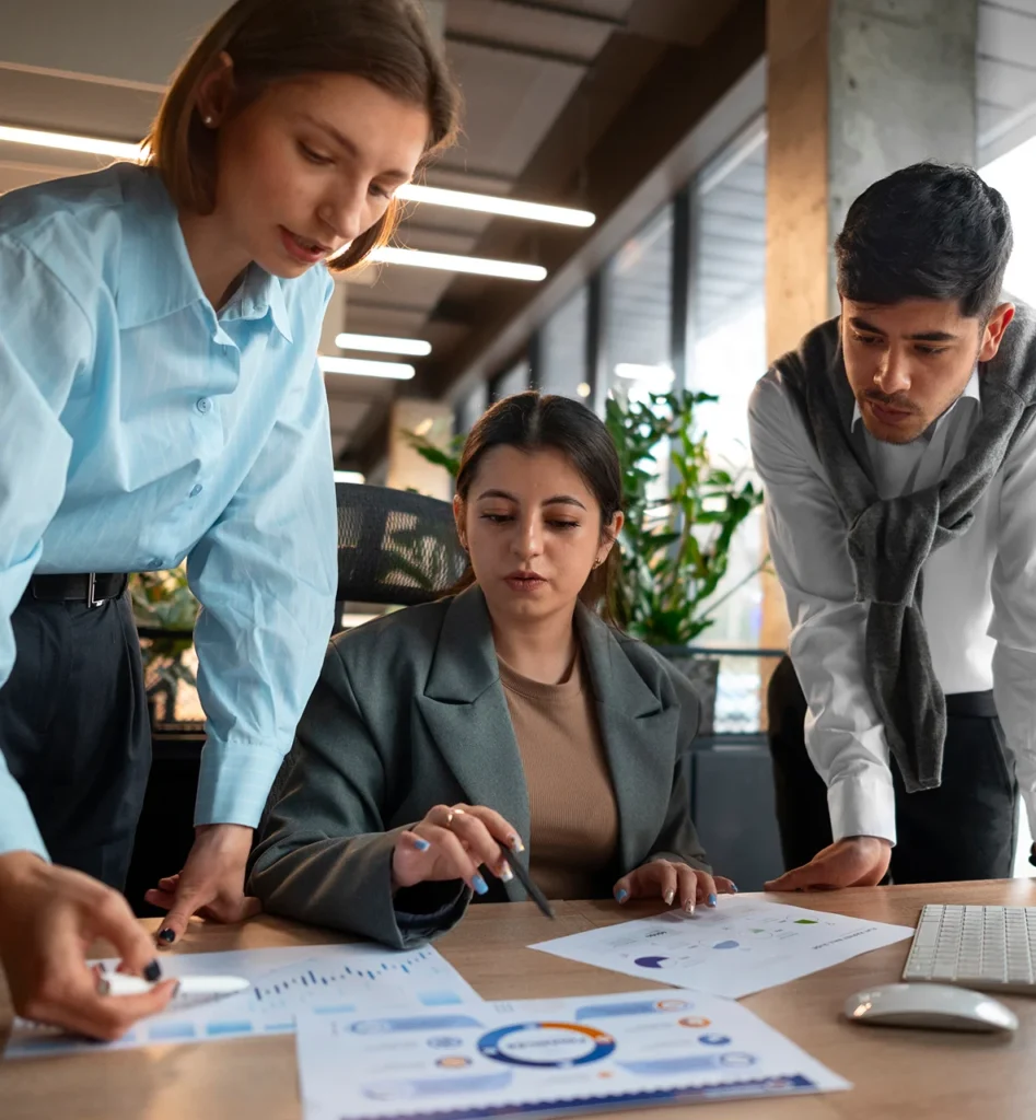 People analyzing checking finance graphs office